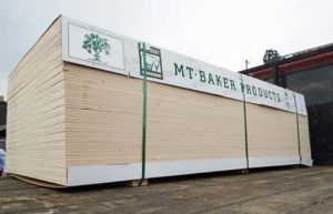 Plywood stacked in a loading area.